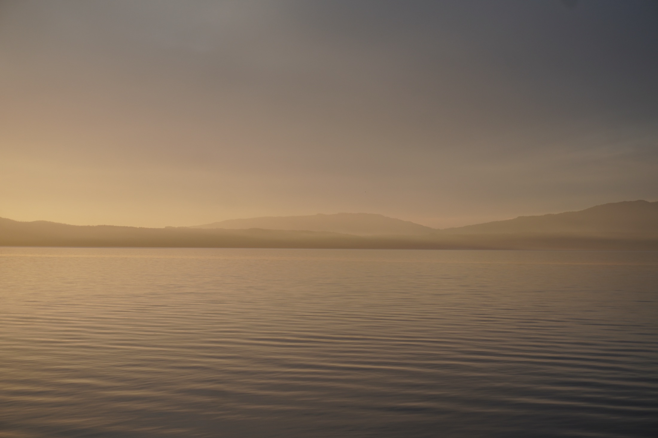 A calm sunrise over still water