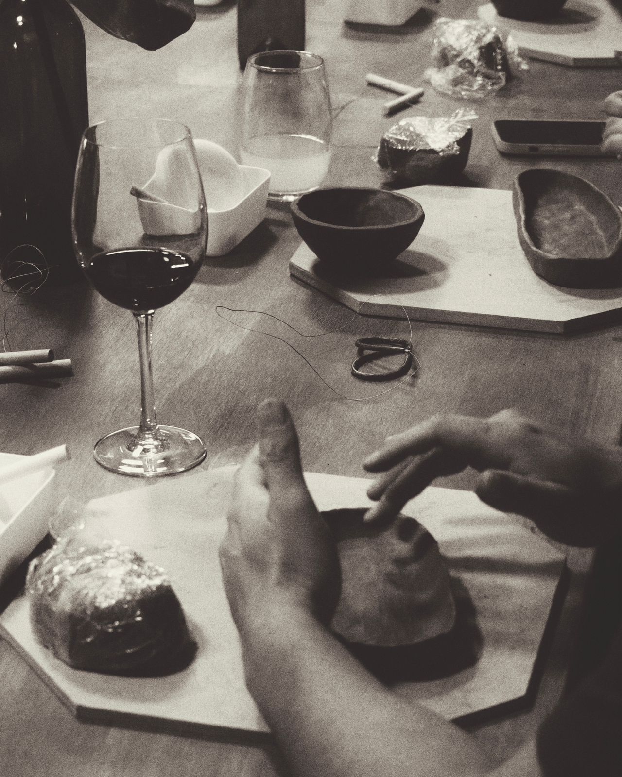Wine, a table, and clay